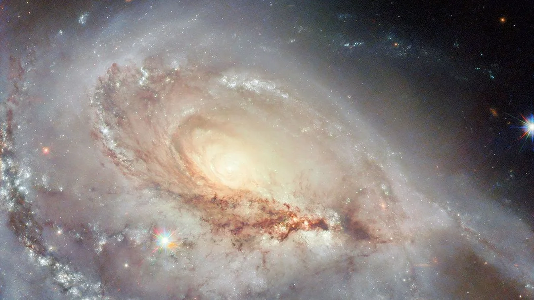 Hubble Captures Stunning Images of Peculiar Spiral Galaxies: A Cosmic Dance of Stars and Serendipity